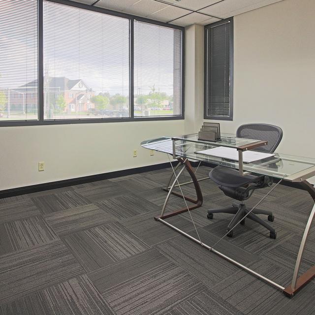 Interior photo of an office space with a view out the window